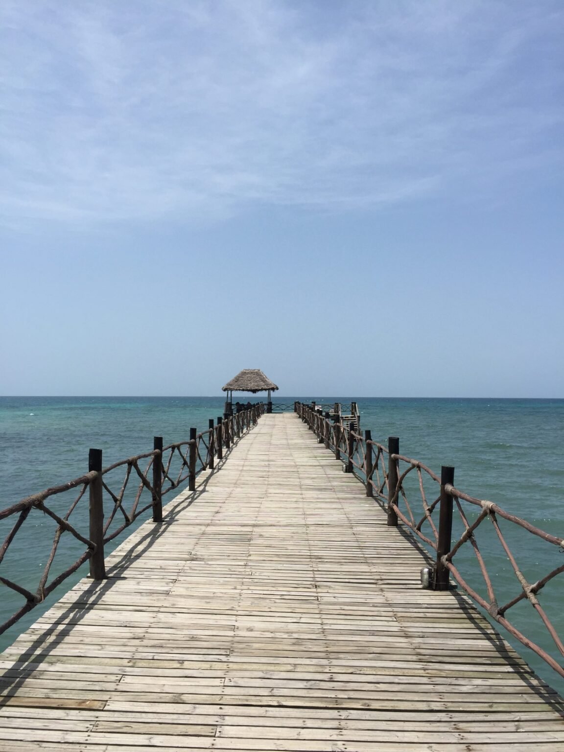 A wooden jetty leading out over the sea in Zanzibar
