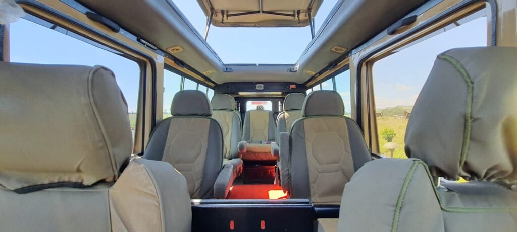 Inside an Africa Keys safari vehicle with the roof hatch open