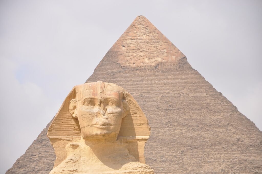 The Great Sphinx with a pyramid behind it